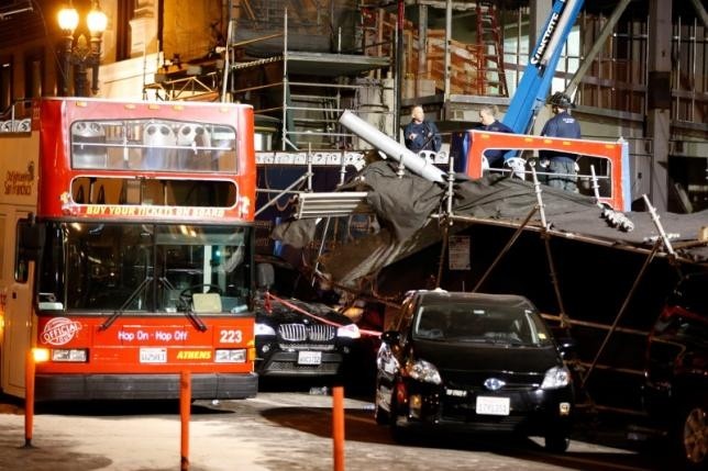 Investigators survey the scene of a multi-vehicle accident near Union Square in San Francisco, California November 13. (Credit: REUTERS)