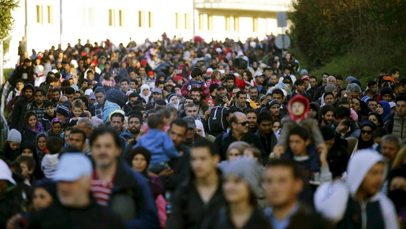 Migrants walk towards the Austrian border after resting in a makeshift camp in the village of Sentilj, Slovenia, October 24, 2015. (Credit: REUTERS)