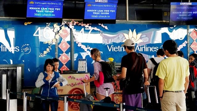 Passengers check-in at Hanoi’s Noi Bai International Airport.