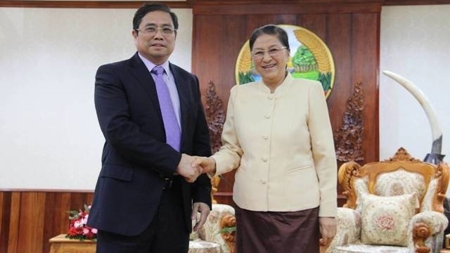 Lao Politburo member and NA Chairman Pany Yathotou (right) receives Vietnamese Politburo member, Secretary of the Party Central Committee and Head of the Party Central Committee’s Organisation Commission. (Credit: NDO)