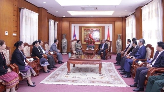 The delegation of the Lao Party Central Committee’s Commission for External Relations visits the Vietnamese Embassy in Vientiane. (Credit: NDO)