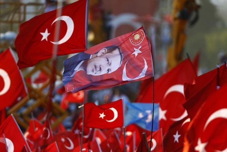 A flag with the picture of Turkey's President Tayyip Erdogan is seen during the Democracy and Martyrs Rally, organized by him and supported by ruling AK Party (AKP), oppositions Republican People's Party (CHP) and Nationalist Movement Party (MHP).