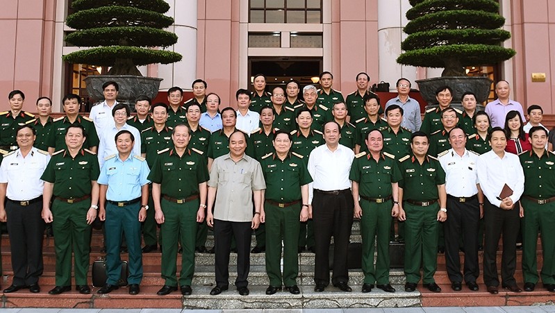 Prime Minister Nguyen Xuan Phuc and other delegates at the working session (Source: VGP)