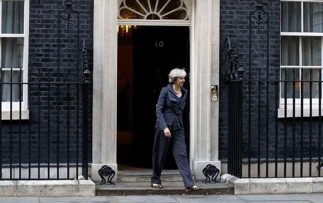 Britain's Prime Minister Theresa May walks out of 10 Downing street to greet the President of the European Parliament Martin Schultz (not shown) in London, September 22, 2016. (Photo: Reuters)