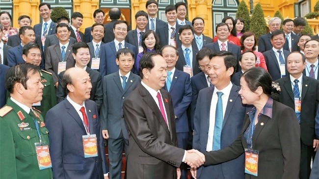 President Tran Dai Quang with the delegates (Photo: VNA)
