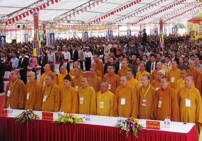 Buddhists and people observe a moment of silence for the road traffic victims.