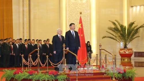 Party General Secretary and President of China Xi Jinping (R) and Party General Secretary Nguyen Phu Trong at the official welcoming ceremony in Beijing on January 12. (Source: VNA)