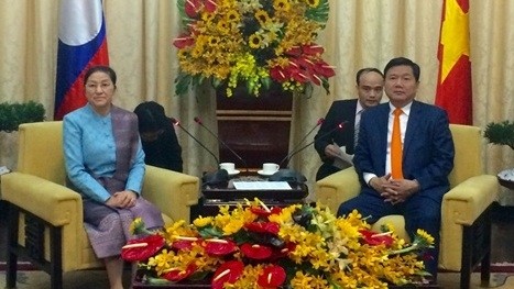 HCMC Secretary Dinh La Thang and Chairwoman of the Lao National Assembly Pany Yathotou