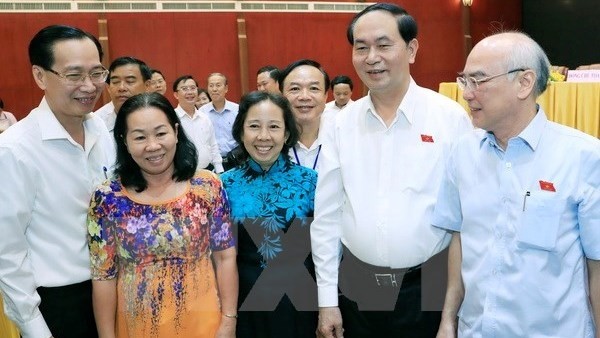 President Tran Dai Quang (second from right) at the July 7 meeting with HCM City voters. 
