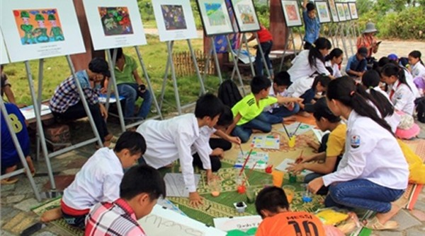 Children taking part in a painting contest at the Vietnam National Village for Ethnic Culture and Tourism