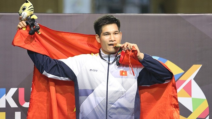 Nguyen Duy Tien and the men's 80kg gold medal.
