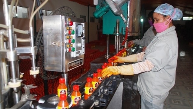 A Muong Khuong chili sauce production line