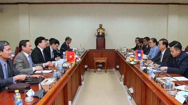 At the working session between Deputy PM Trinh Dinh Dung and Lao NA Vice Chairman Somphan Phengkhammy.
