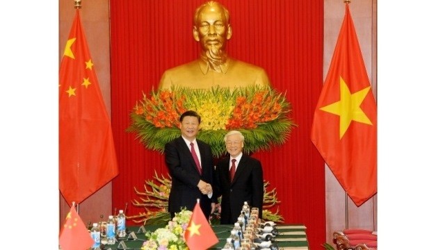 General Secretary of the CPV Central Committee Nguyen Phu Trong (R) and General Secretary of the CPC Central Committee and State President Xi Jinping. (Credit: VGP)