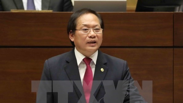 Minister of Information and Communications Truong Minh Tuan at the National Assembly question-and-answer session on November 17 (Photo: VNA)