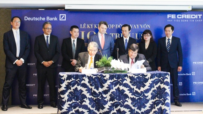 At the signing ceremony for the loan