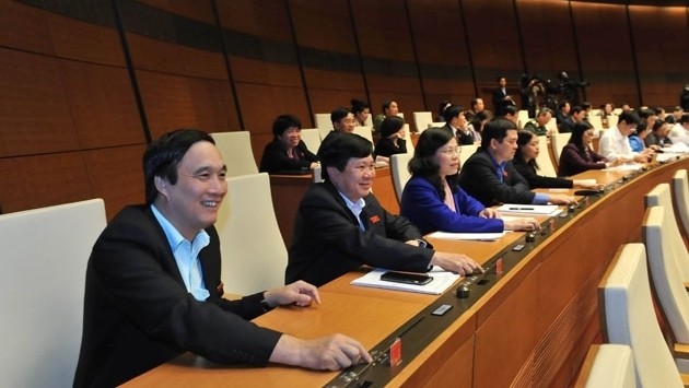 NA deputies press the voting button to pass the two important solutions on late November 24. (Credit: NDO)