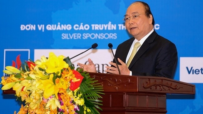 PM Nguyen Xuan Phuc speaks at the forum. (Photo: VGP)