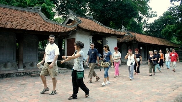Foreign tourists visit Hanoi’s Temple of Literature.