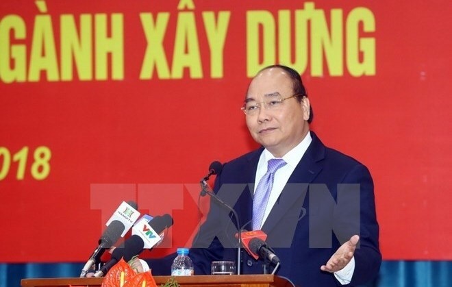 Prime Minister Nguyen Xuan Phuc speaks at the conference held by the Ministry of Construction in Hanoi on January 16. (Photo: VNA)  