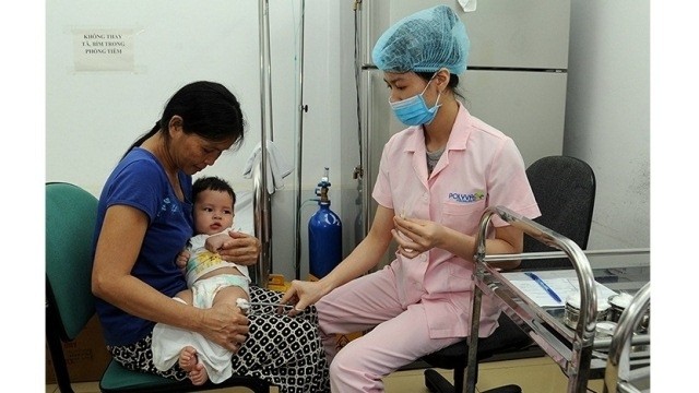 The health sector is implementing measures to facilitate the goal of providing healthcare for all. (Photo: Duc Anh)