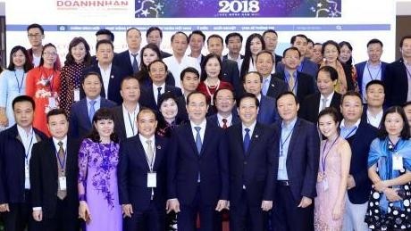 President Tran Dai Quang (in the middle) with the delegates (Photo: VNA)