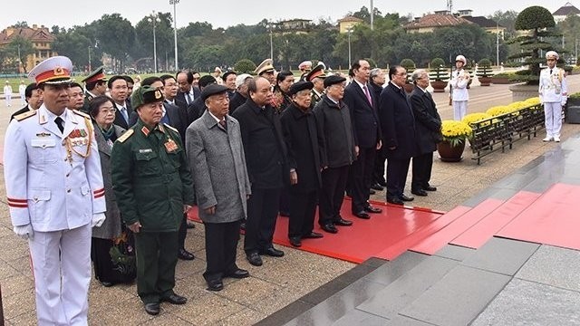 Party and State leaders pay respects to President Ho Chi Minh at his mausoleum in Hanoi.