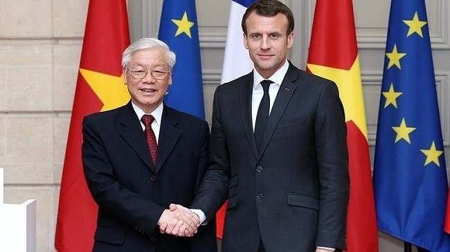 Party General Secretary Nguyen Phu Trong (left) and French President Emmanuel Macron. (Photo: VNA)