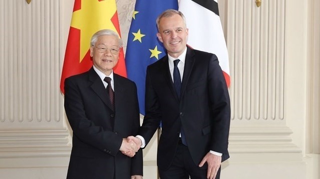 Party General Secretary Nguyen Phu Trong (L) welcomed by President of France’s National Assembly Francois de Rugy (Source: VNA)