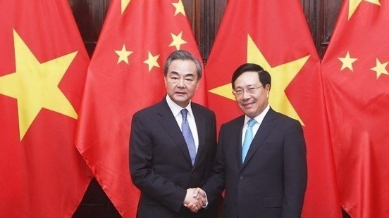 Deputy Prime Minister and Foreign Minister Pham Binh Minh (R) and State Councillor and Foreign Minister of China Wang Yi (Photo: VNA)
