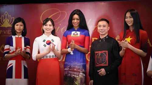 Fashion designer Do Trinh Hoai Nam (fourth from left) and models in his Ao Dai designs featuring the national flags of different countries