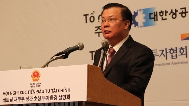Minister of Finance Dinh Tien Dung speaking at the conference. (Photo: VN+)