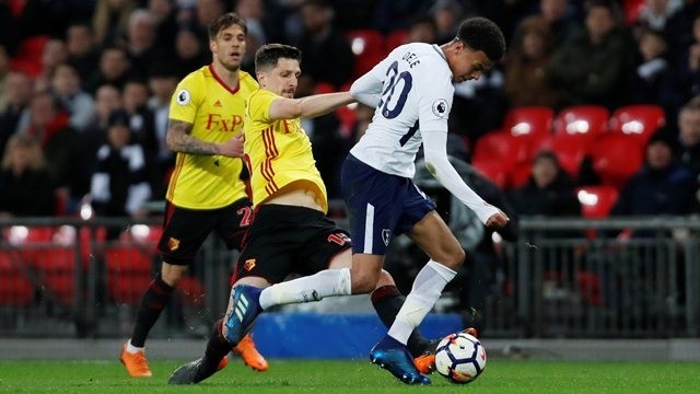 Tottenham's Dele Alli in action with Watford's Craig Cathcart. (Photo: Action Images via Reuters)