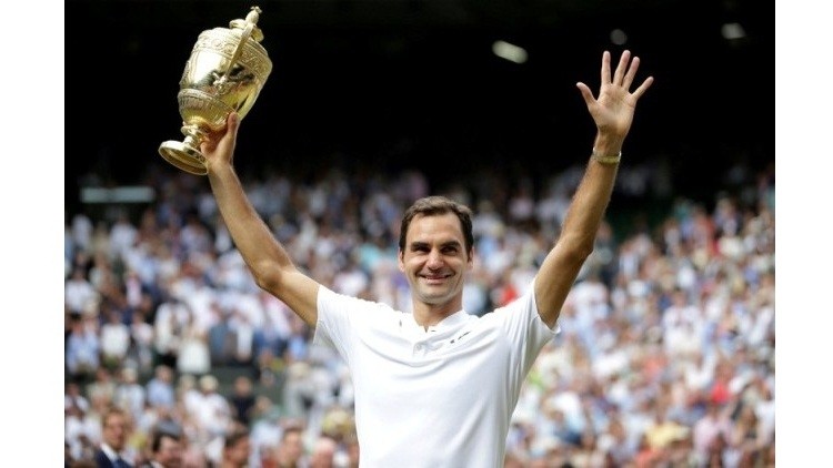 Switzerland’s Roger Federer poses with the trophy at Wimbledon as he celebrates winning the 2017 final against Croatia’s Marin Cilic. (Photo: Reuters)