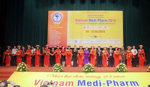 Delegates cut the ribbon to launch the Vietnam Medi-Pharm 2018.