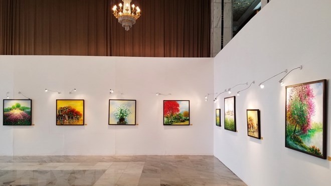 Paintings on display at the exhibition (Photo: VNA)