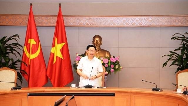 Deputy PM Vuong Dinh Hue speaks at the working session. (Photo: NDO)