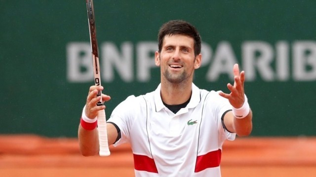 Serbia's Novak Djokovic celebrates after winning his third round match against Spain's Robert Bautista Agut. (Photo: Reuters)