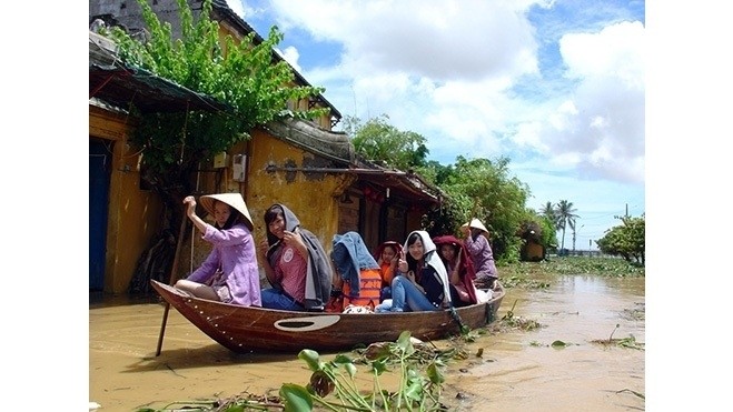 Tourists enjoy new experiences with Hoi An floods.
