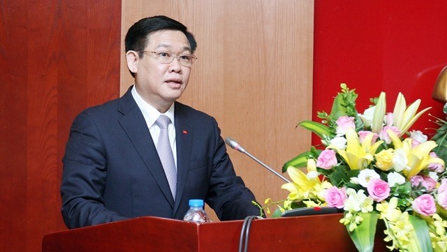 Deputy PM Vuong Dinh Hue speaks at the symposium in Hanoi on June 10. (Photo: VNA)