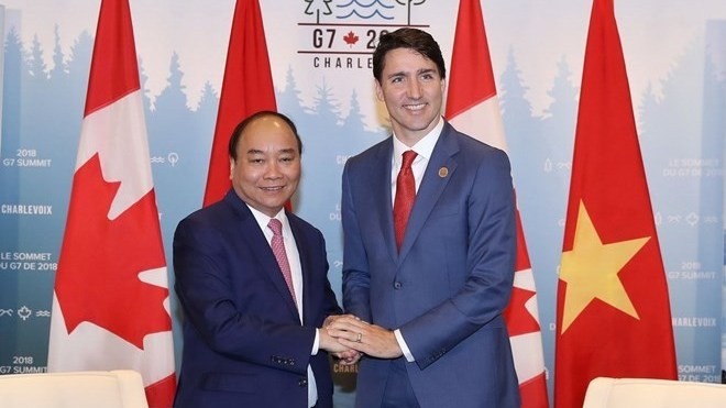 Prime Minister Nguyen Xuan Phuc (left) and his Canadian counterpart Justin Trudeau (Source: VNA)