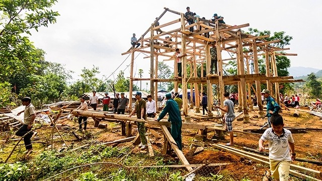 Dozens of men and women in the village came together to help to build the house