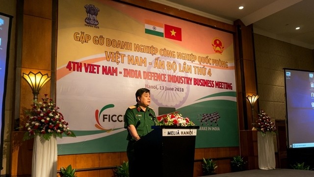 Major General Ho Quang Tuan, Deputy Head of the General Department of Defence Industry, speaks at the event. (Photo: NDO/Trung Hung)