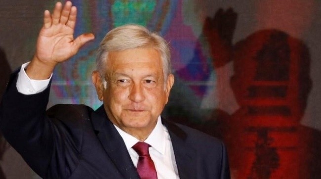 Andres Manuel Lopez Obrador waves as he addresses supporters after polls closed in the presidential election, in Mexico City, Mexico July 1, 2018. (Reuters)