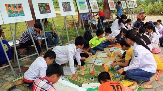 Children participating at a painting contest at the Vietnam National Village for Ethnic Culture and Tourism