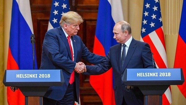 US President Donald Trump and Russian President Vladimir Putin shake hands during a joint news conference after their meeting in Helsinki, Finland on July 16. (Photo: Getty)