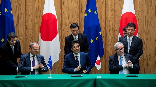 President of the European Council, Donald Tusk, Japanese PM Shinzo Abe, and President of the European Commission, Jean-Claude Juncker, at the JEFTA signing ceremony. (Photo: Reuters)