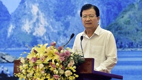 Deputy PM Trinh Dinh Dung speaks at the conference. (Photo: VGP)