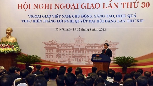 Deputy Prime Minister and Minister of Foreign Affairs Pham Binh Minh opens the 30th Diplomatic Conference in Hanoi on August 13. (Photo: NDO/Duy Linh)