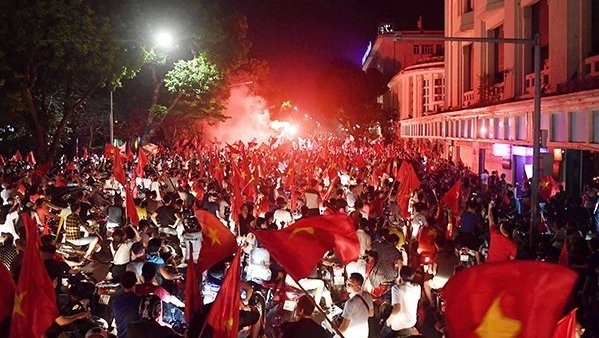Streets around Hanoi’s Hoan Kiem Lake were painted red with national flags, as fans raucously celebrated with cheers of “Vietnam Champions”.